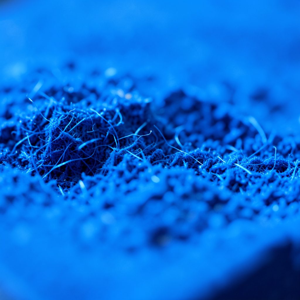 Close-up of a smartphone screen displaying news headlines against a dark gradient background